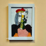 "picasso,woman in red pom hat"