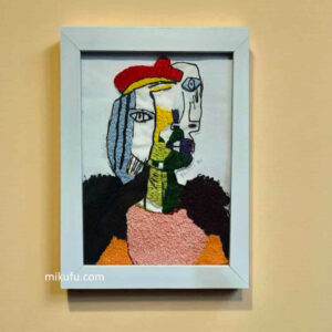 "picasso,woman in red pom hat"