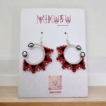 small earrings made of beads in a silver frame