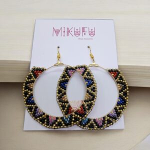earrings made of beads in a golden frame
